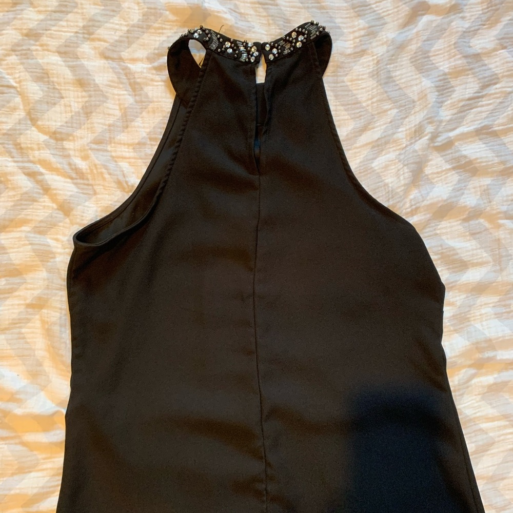 Black blouse tank top with sequin neck line.